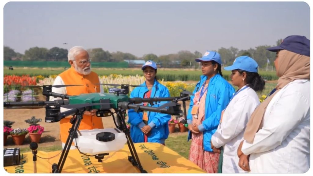 Drone instructor teaching female drone pilots