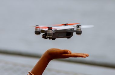 Child's hand releasing a drone