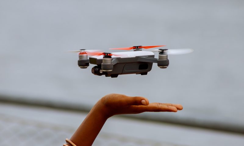 Child's hand releasing a drone