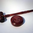 Gavel and dollar sign representing penalties