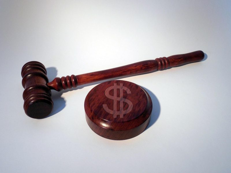 Gavel and dollar sign representing penalties