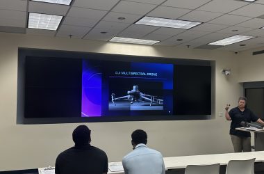 Woman teaching students at Florida International University about drone technology and applications.