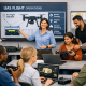 Group of people learning about UAS pre-flight checks in a classroom setting.